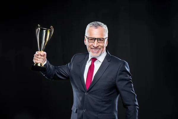 Uomo d'affari con coppa premio — Foto Stock