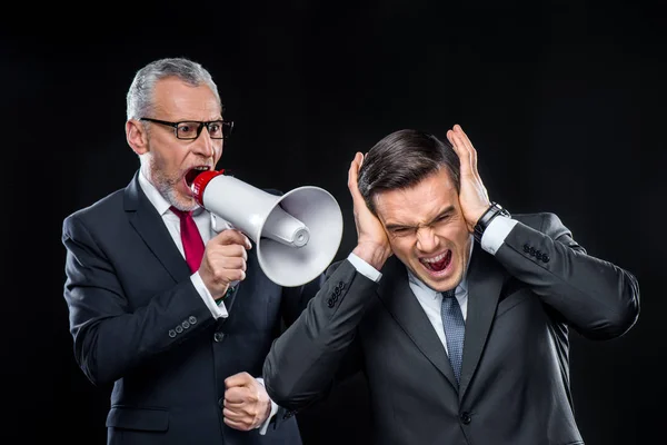 Mature businessman with loudspeaker — Stock Photo, Image