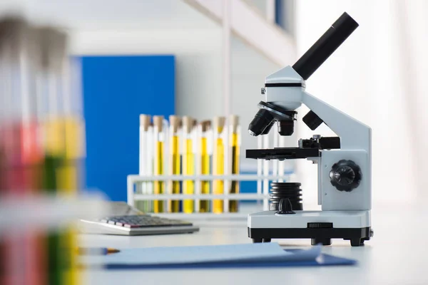 Microscope and test tubes — Stock Photo, Image