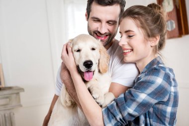Young couple with puppy clipart