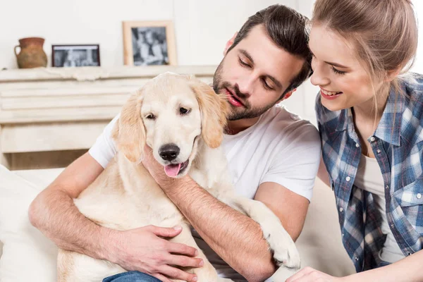 Young couple with puppy — Stock Photo, Image