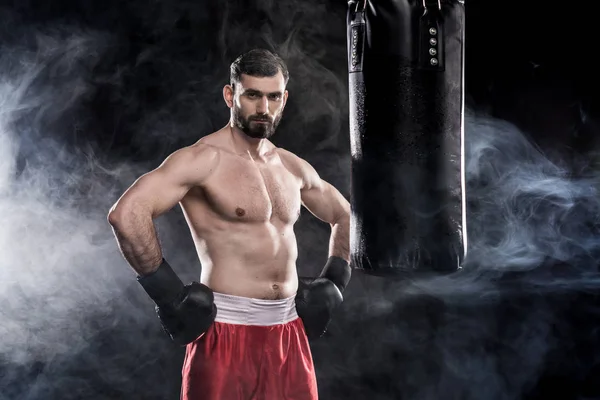 Boxer with punching bag — Stock Photo, Image