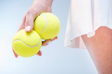 Female tennis player with balls clipart