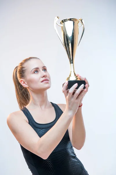 Woman holding trophy Stock Photo