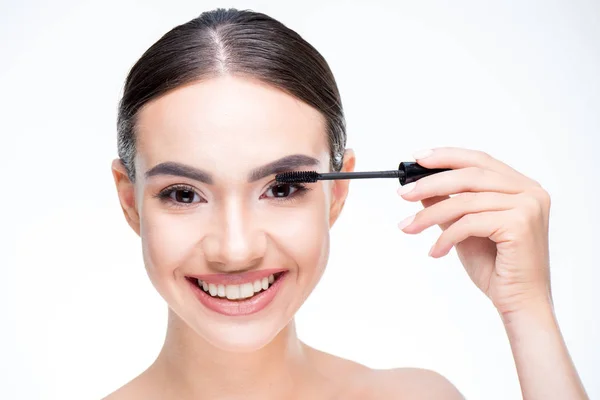 Woman painting eyelashes by mascara — Stock Photo, Image