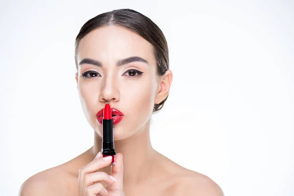 Woman holding red lipstick — Stock Photo, Image