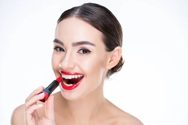 Woman holding red lipstick — Stock Photo, Image