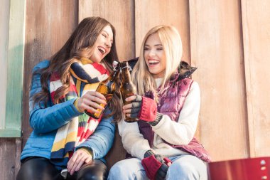 women holding beer bottles clipart