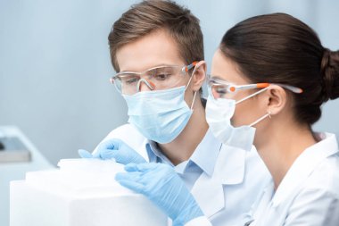 Scientists making experiment clipart