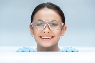 scientist looking out behind table clipart