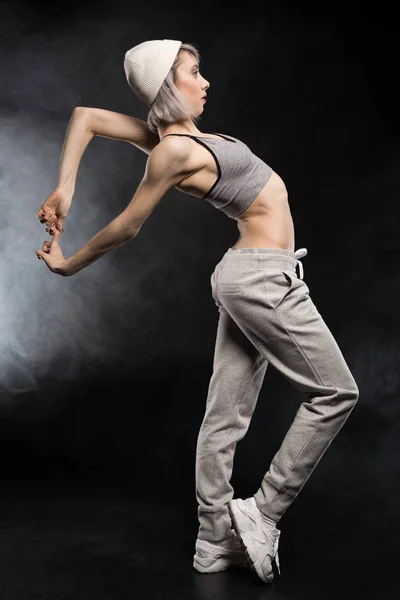 Dancing woman in sports clothing — Stock Photo, Image