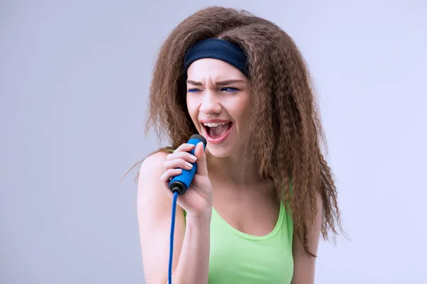 Woman with skipping rope — Stock Photo, Image