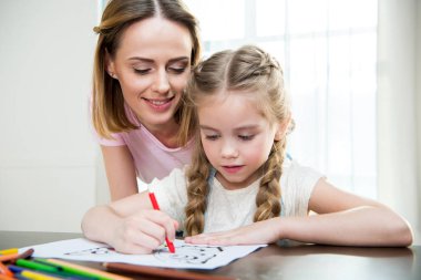 Mother and daughter drawing clipart