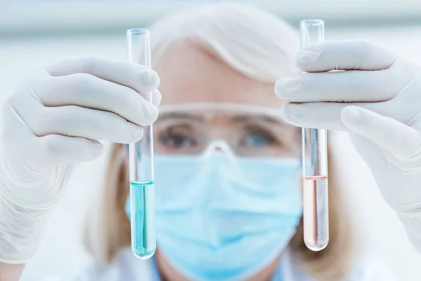 Senior chemist with test tubes — Stock Photo, Image