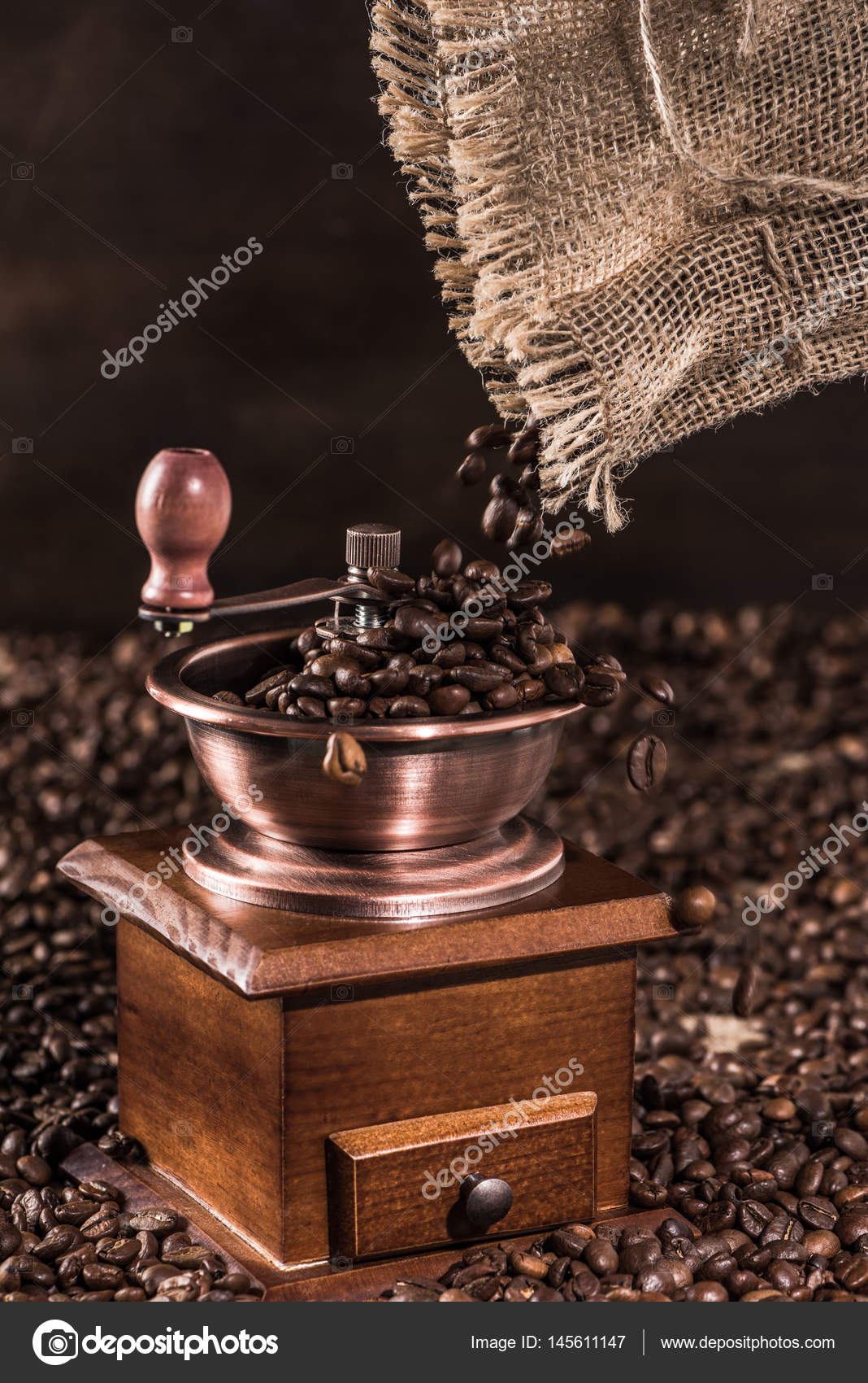Coffee mill with coffee beans — Stock Photo © DmitryPoch 145611147