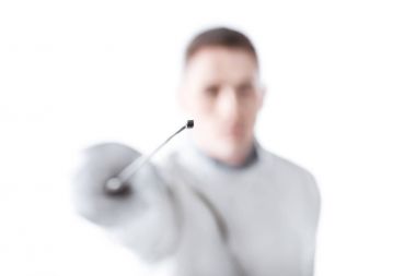 Young man fencing  clipart