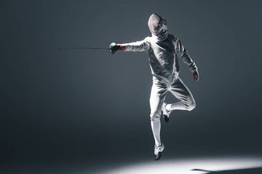 Professional fencer with rapier clipart