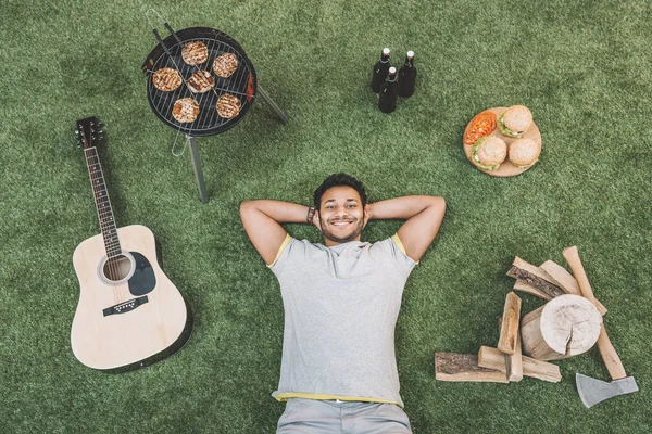 Man resting on grass — Stock Photo, Image