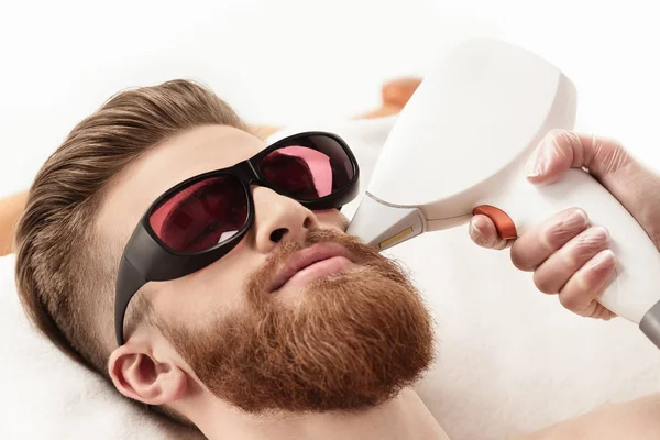 Man receiving laser skin care — Stock Photo, Image