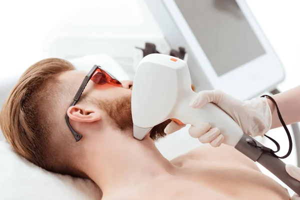 Man receiving laser skin care — Stock Photo, Image