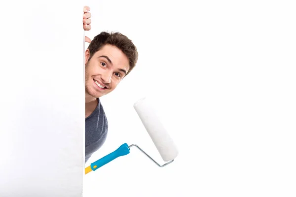 Man holding paint roller — Stock Photo, Image