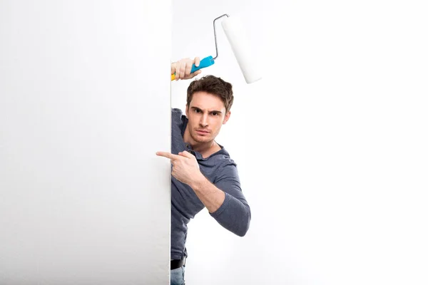 Man holding paint roller — Stock Photo, Image