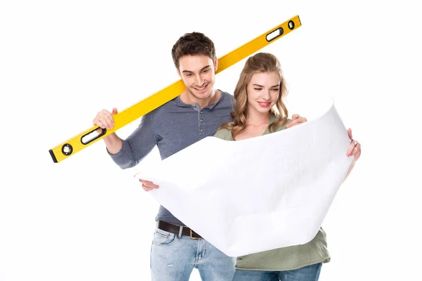 Young couple with blueprint — Stock Photo, Image