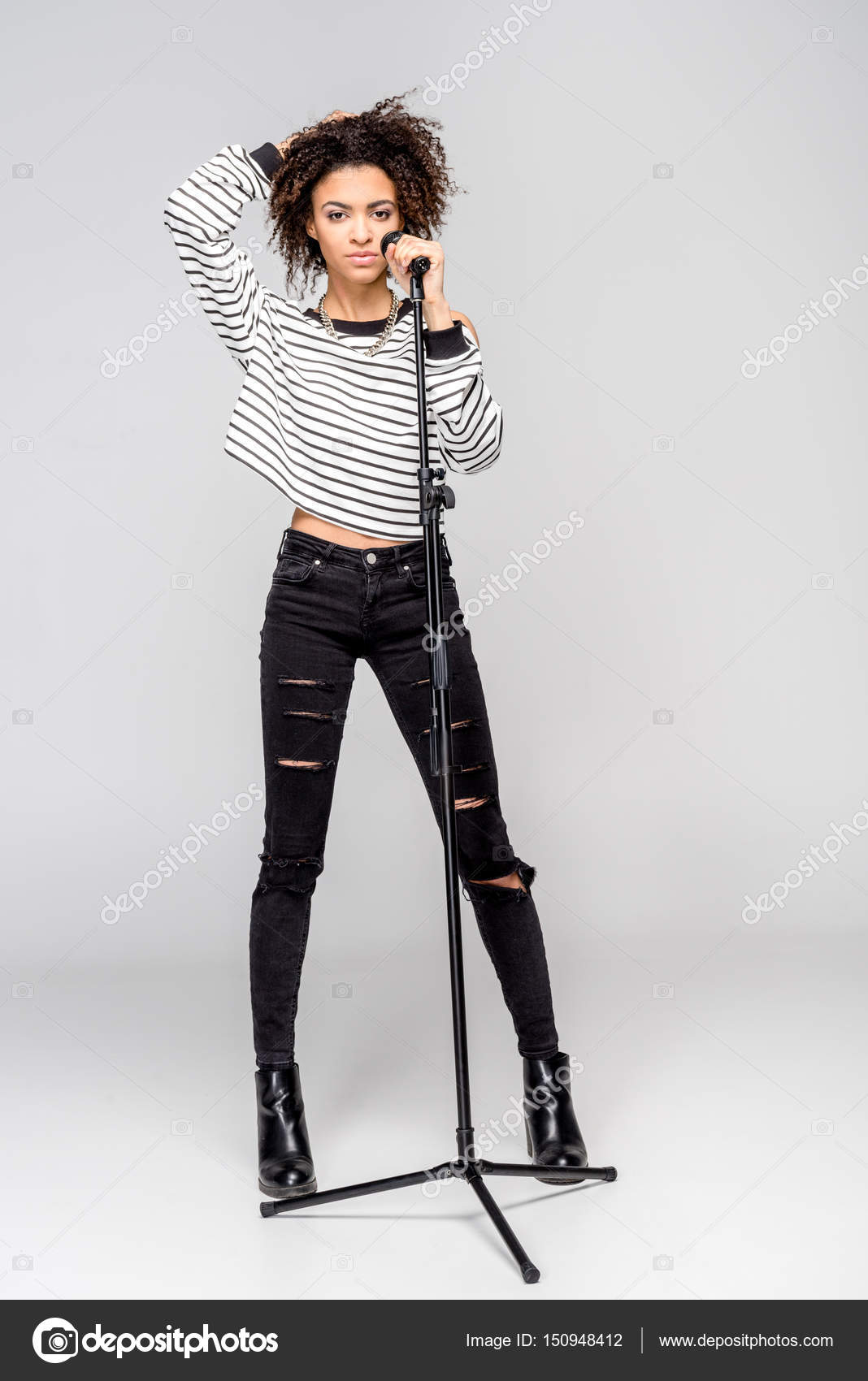 Young singer with microphone — Stock Photo © DmitryPoch #150948412