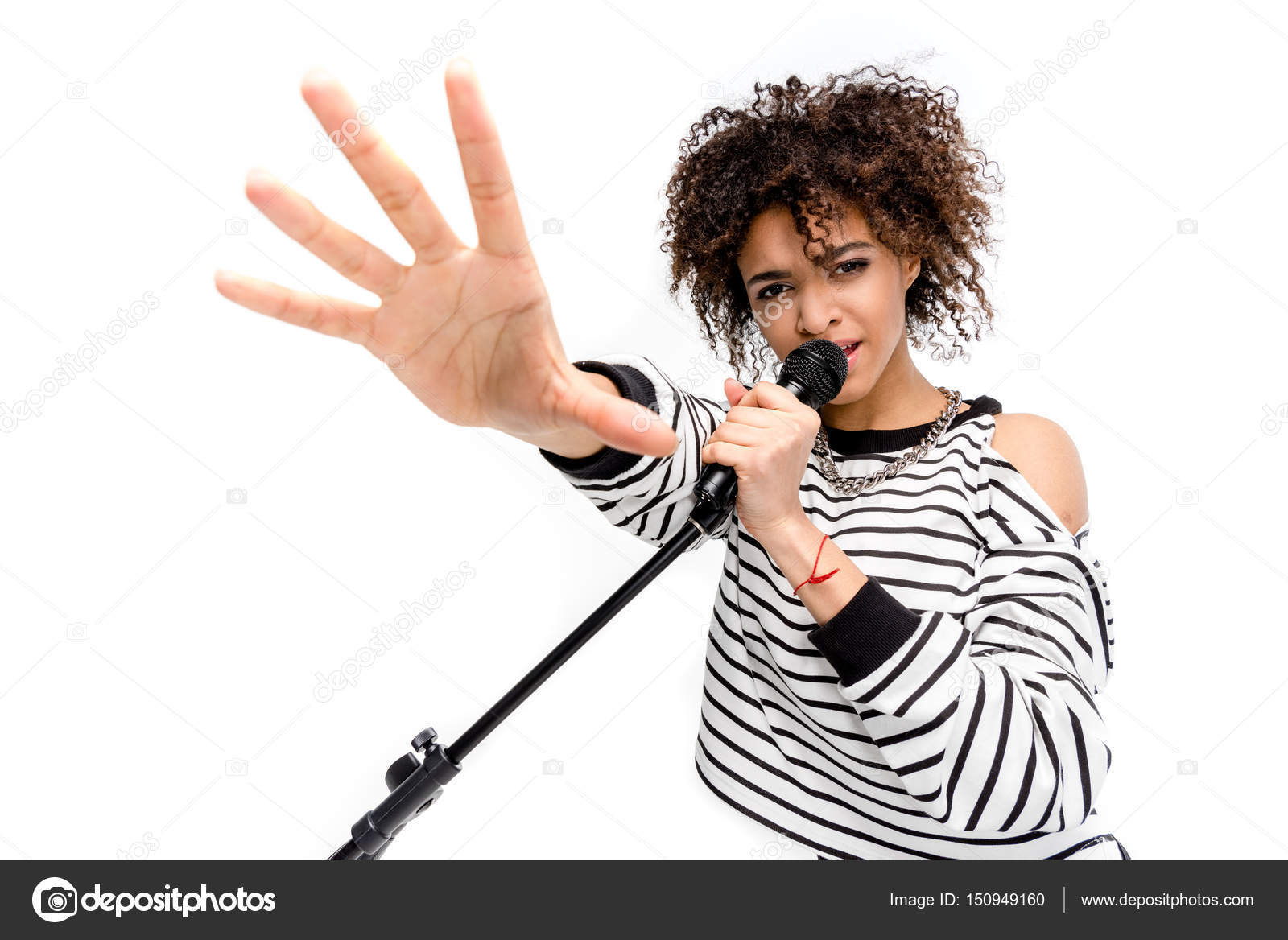 Young singer with microphone — Stock Photo © DmitryPoch 150949160