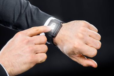 Businessman using smart watch clipart