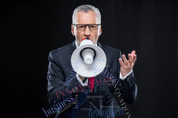 Senior businessman with loudspeaker — Stock Photo, Image