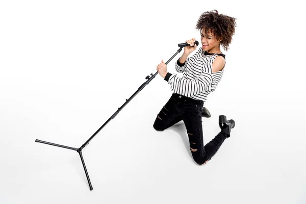 Young singer with microphone — Stock Photo, Image