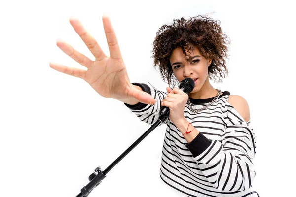 Young singer with microphone — Stock Photo, Image