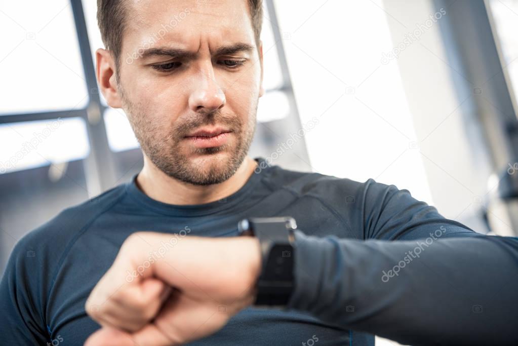 Man using smartwatch at gym — Stock Photo © DmitryPoch #151089376