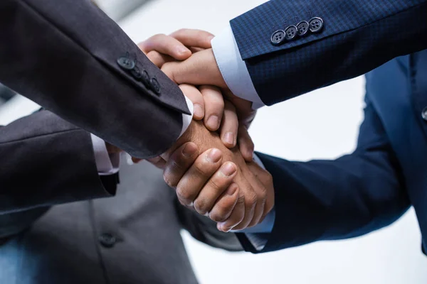 Businesspeople stacking hands — Stock Photo, Image
