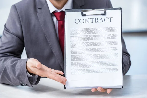Businessman holding contract — Stock Photo, Image