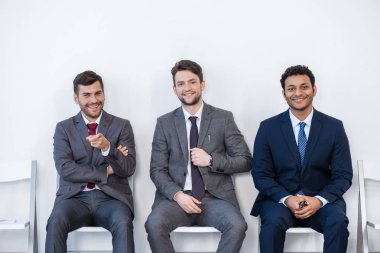 businessmen sitting on chairs clipart