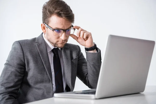 Businessman sitting at workplace — Free Stock Photo