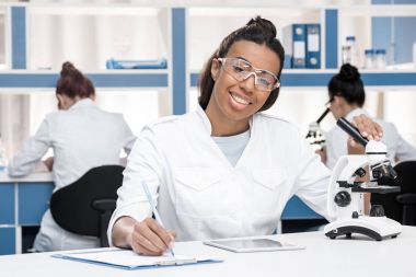 scientist working in chemical lab    clipart