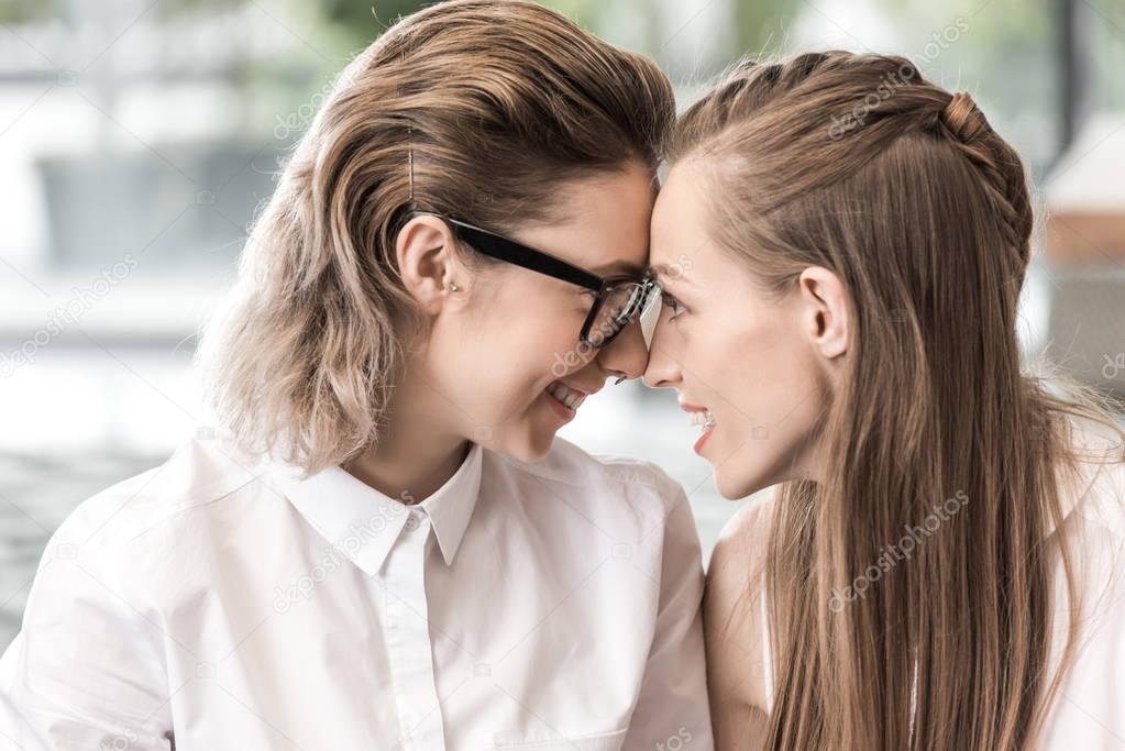 Portrait of happy lesbian couple looking at each other while spending time together