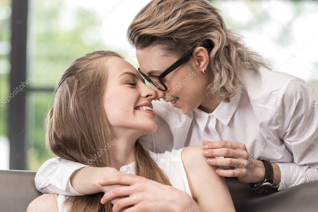 Portrait of happy lesbian couple looking at each other while spending time together