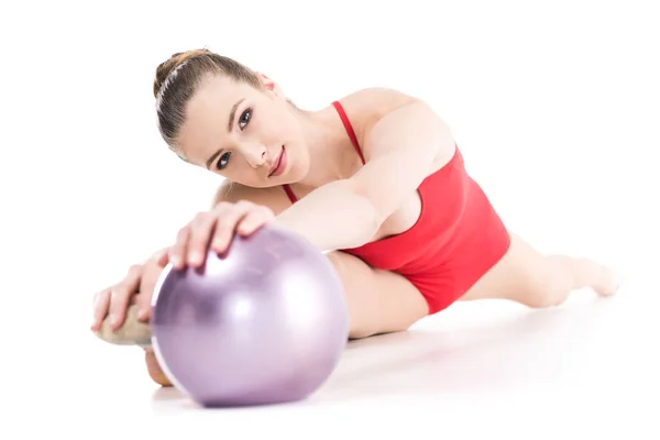 Rhythmic gymnast exercising with ball — Stock Photo, Image