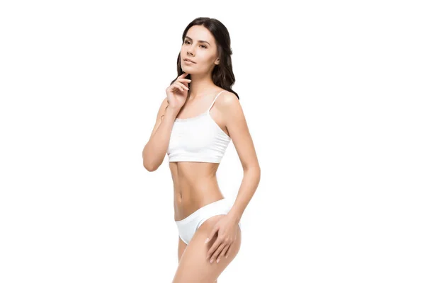 Kvinna poserar i vita underkläder — Stockfoto