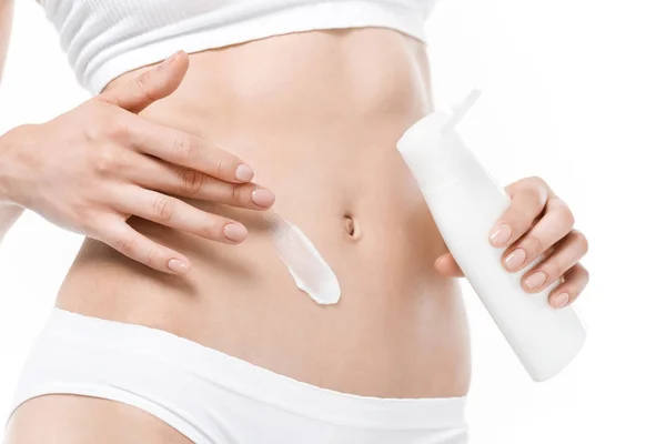 Woman applying body cream — Stock Photo, Image