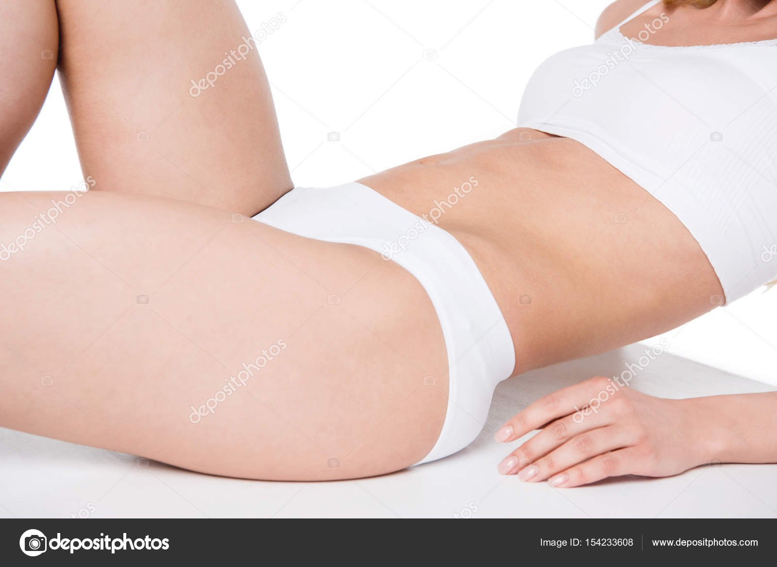 Young girl in white underwear lying Stock Photo by ©DmitryPoch 154233608