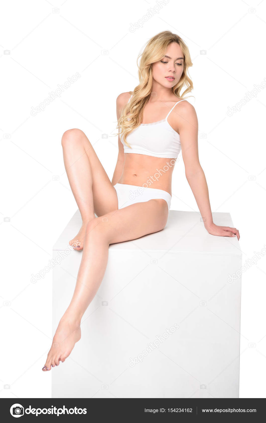 Young girl in white underwear lying Stock Photo by ©DmitryPoch