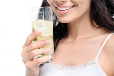 woman holding glass of water with lemon clipart