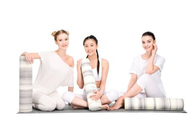 multiethnic girls with yoga mats clipart