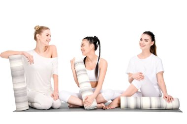 multiethnic girls with yoga mats clipart