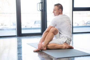 man practicing yoga clipart